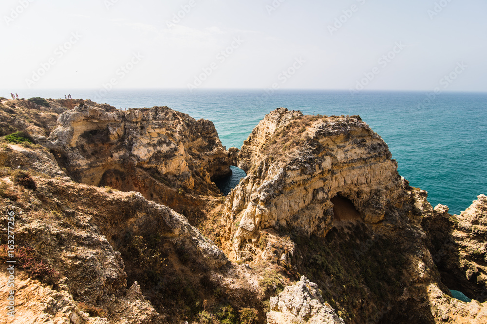 Beautiful sandstone rock formation with a cave near Atlantic ocean Beautiful sandstone rock formation with a cave near Atlantic ocean