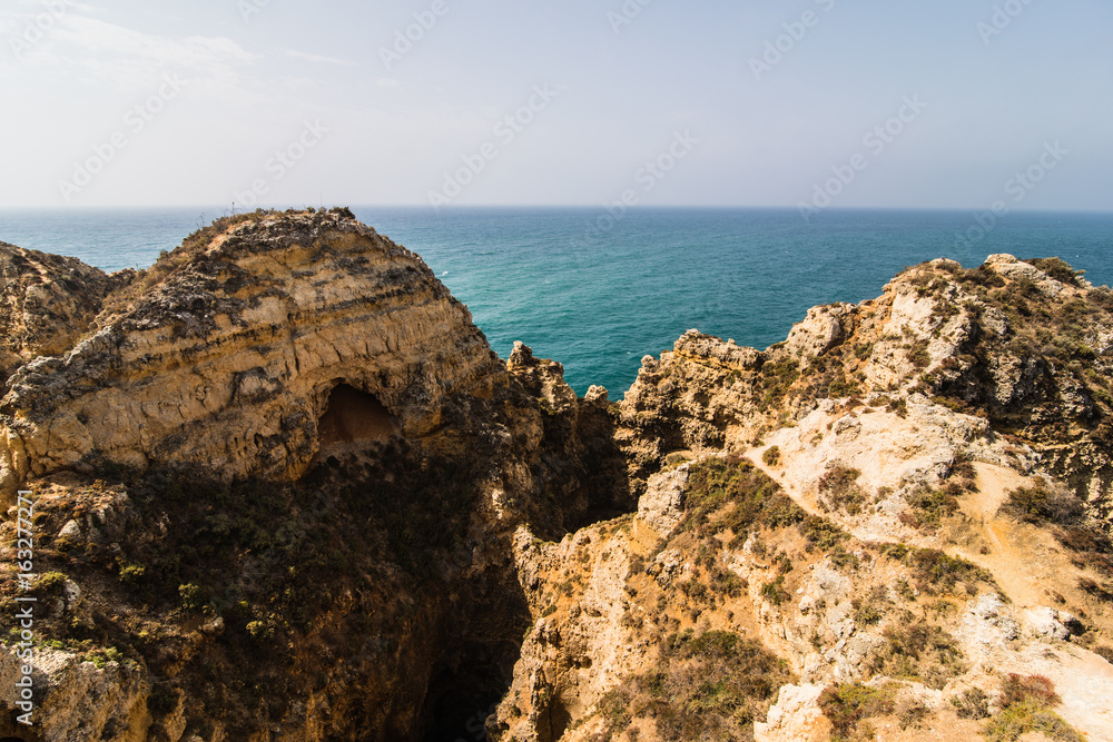 Beautiful sandstone rock formation with a cave near Atlantic ocean