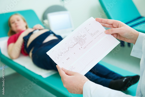 Fotografija Pregnancy care. cardiotocography fetal heartbeat examination