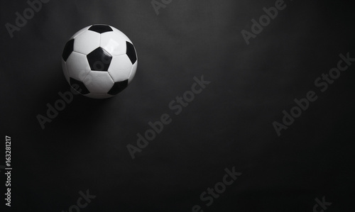 Fototapeta Naklejka Na Ścianę i Meble -  Classic soccer ball on black background.