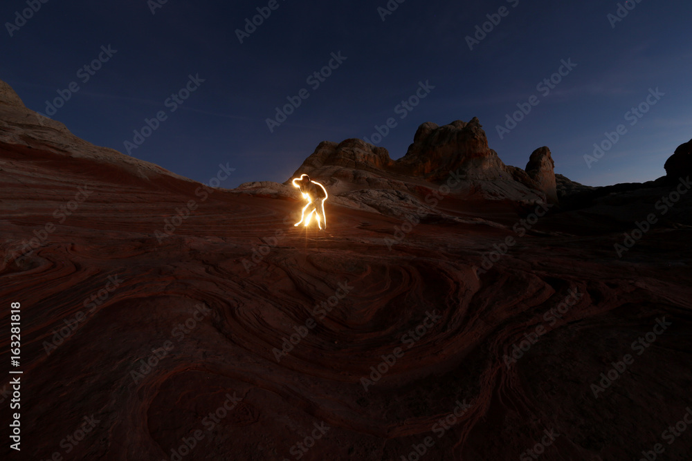 Naklejka premium Photographer in lights canyon