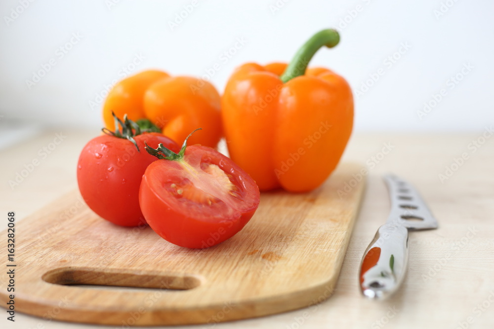 tomatoes and peppers on the Board tomatoes and peppers on the Board