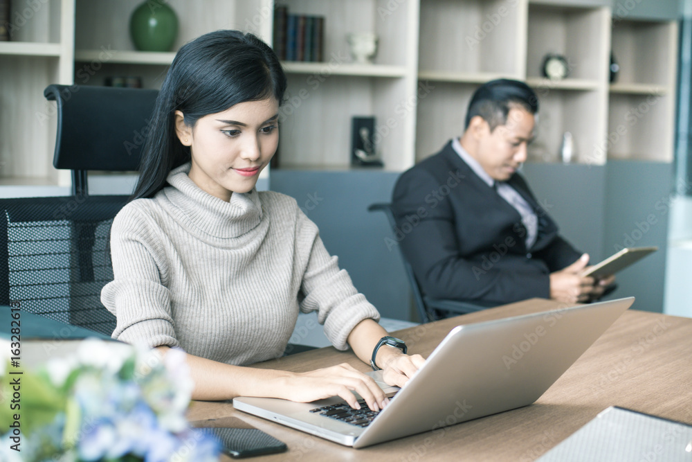 Beautiful young asian woman working at office with happy emotion, woman working concept, 20-30 years old. Beautiful young asian woman working at office with happy emotion, woman working concept, 20-30 years old.