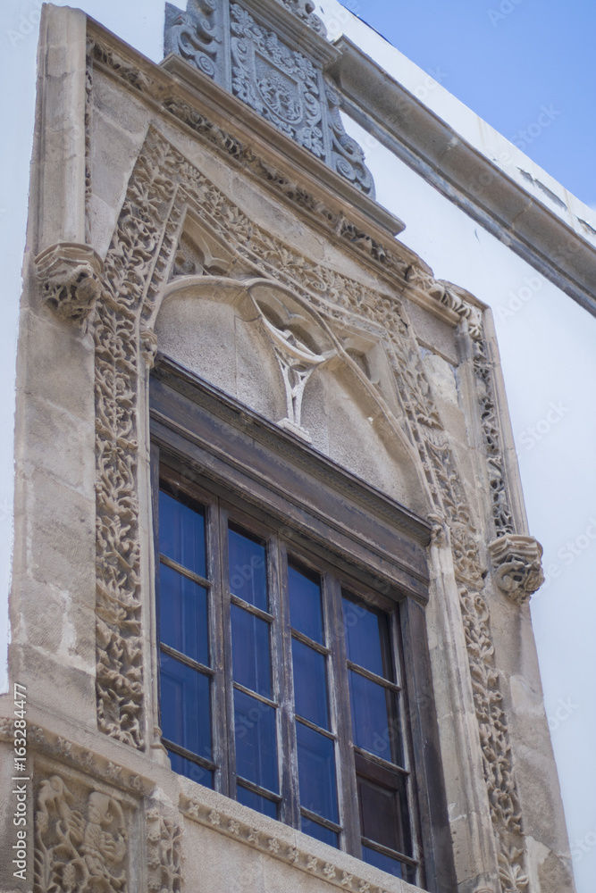 Obraz premium Old window with stone decorations.