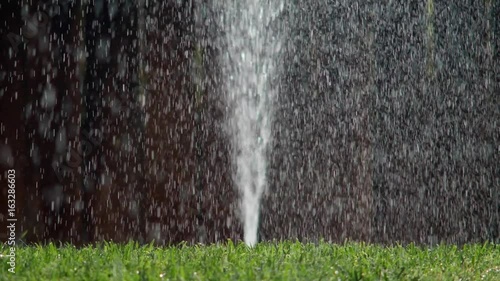 RUPTURED SPRINKLER PIPE SHOOTING WATER STRAIGHT UP.  Version 2 of 2.
