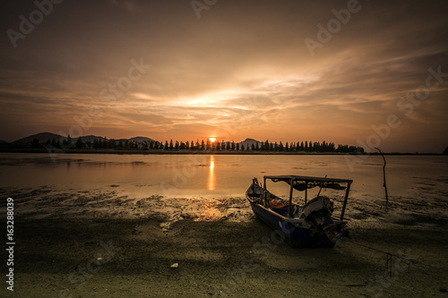 scenery of sunset at lumut perak.soft focus,motion blur due to long exposure © airell
