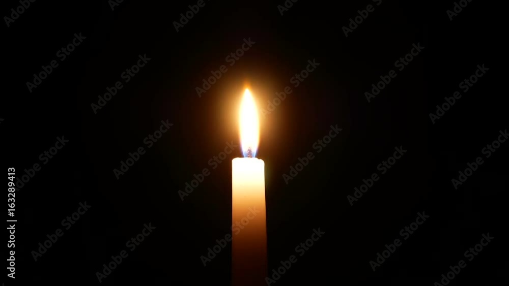 White candle burns in the dark White candle burns in the dark