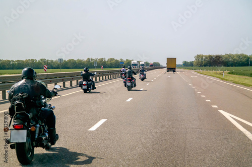 A group of bikers are driving along the highway © a11adin
