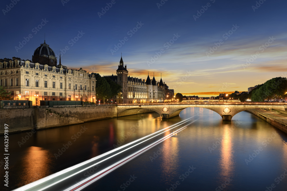 Boat tour on Seine river in Paris with sunset. Paris, France