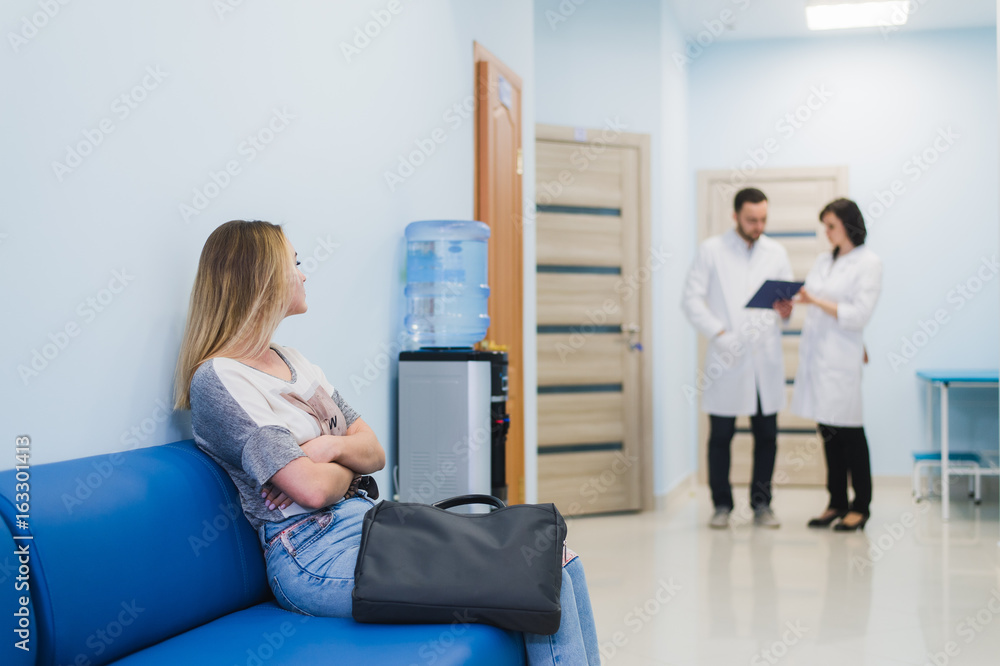 Woman patient waiting at hospital Doctors Waiting Room Woman patient waiting at hospital Doctors Waiting Room