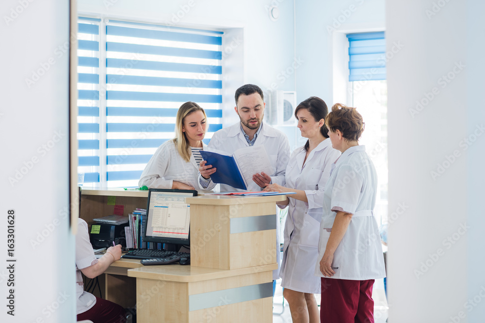 Doctor and receptionist at reception in a hospital Doctor and receptionist at reception in a hospital