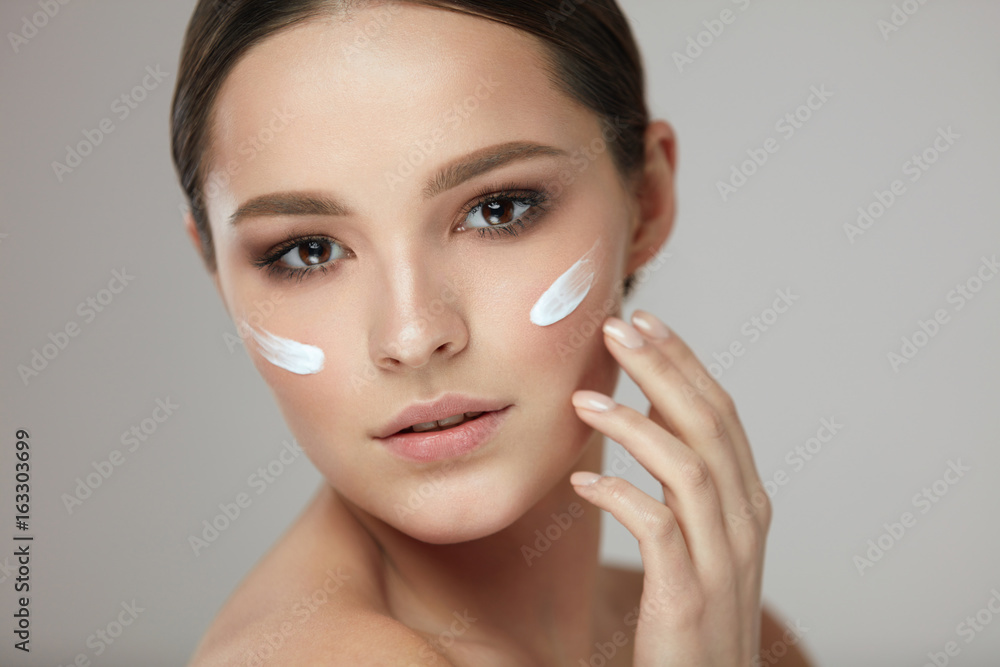 Woman Beauty Face Care. Portrait Of Female With Facial Cream Woman Beauty Face Care. Portrait Of Female With Facial Cream
