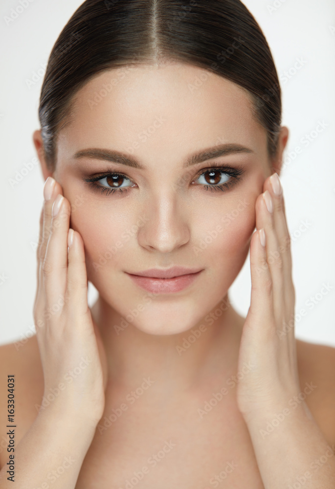 Beauty Woman Face. Girl With Natural Makeup Touching Facial Skin Beauty Woman Face. Girl With Natural Makeup Touching Facial Skin
