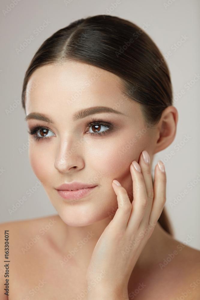 Cosmetic Face Care. Young Woman Caressing Facial Skin Cosmetic Face Care. Young Woman Caressing Facial Skin