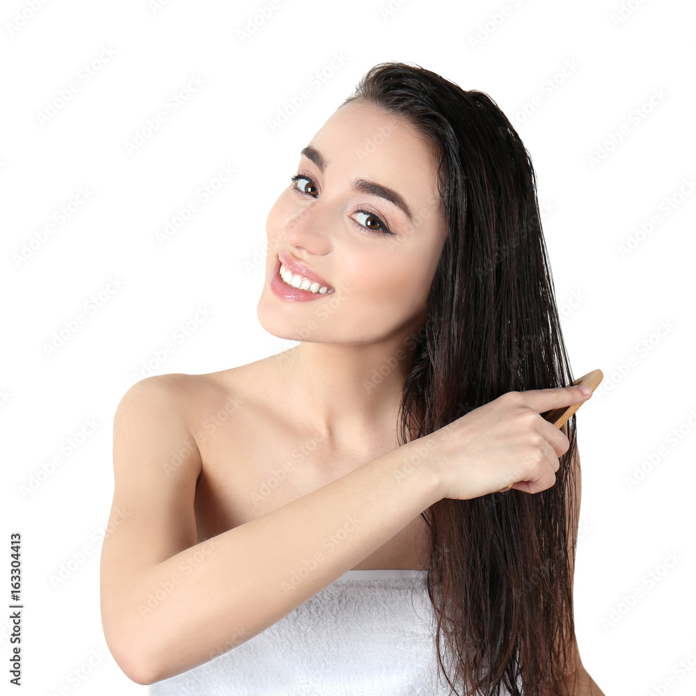 Young woman combing hair after shower on white background Stock Photo |  Adobe Stock