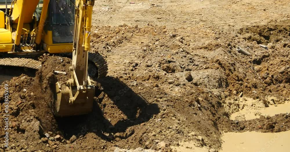 4k closeup excavator working & dumper truck on construction site,china. 4k closeup excavator working & dumper truck on construction site,china.