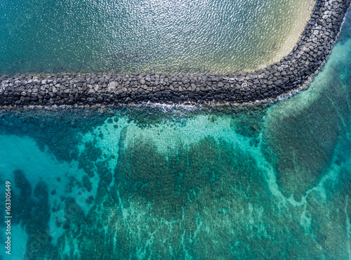 Фотография Aerial view of the breakwater in the Haleiwa Harbor on the north shore of Oahu H