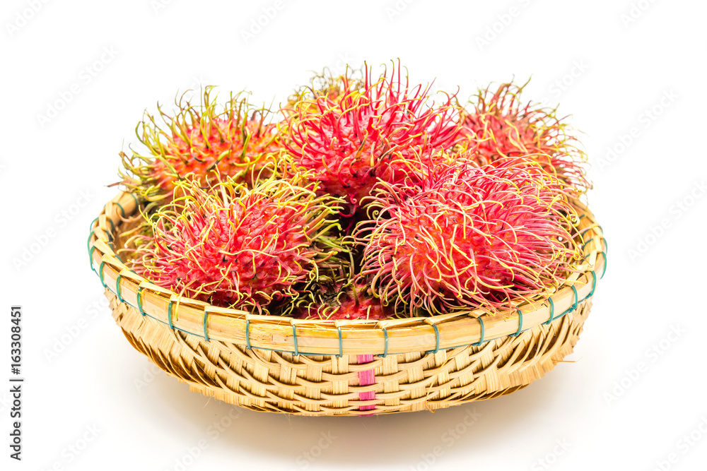 fresh tropical rambutan fruits over basket on a white background, fruit in Thailand fresh tropical rambutan fruits over basket on a white background, fruit in Thailand