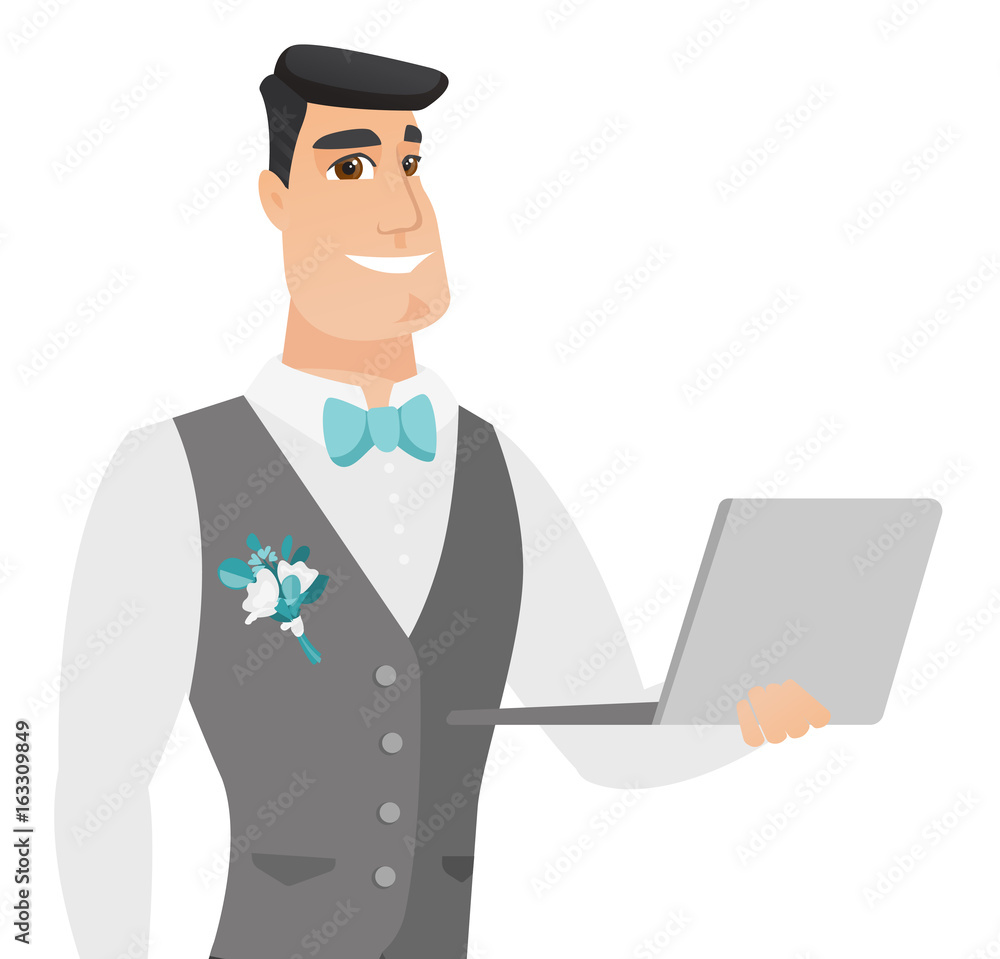 Young caucasian groom using a laptop.