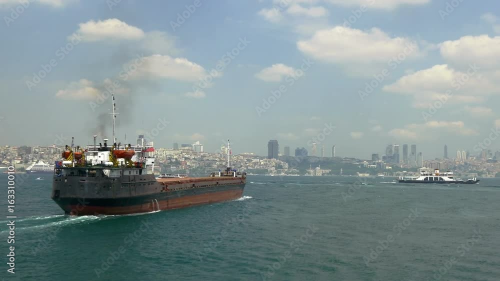Tracking cargo freighter heading into straits of Istanbul from South. 48 sec. 30 fps UHD 4K Video. Bulk carriers are intended basically for carrying of bulk cargoes such as coal, timber, cement, vario Tracking cargo freighter heading into straits of Istanbul from South. 48 sec. 30 fps UHD 4K Video. Bulk carriers are intended basically for carrying of bulk cargoes such as coal, timber, cement, vario