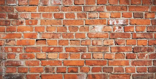 Ancient red brick wall. Simple brick wall background or texture.