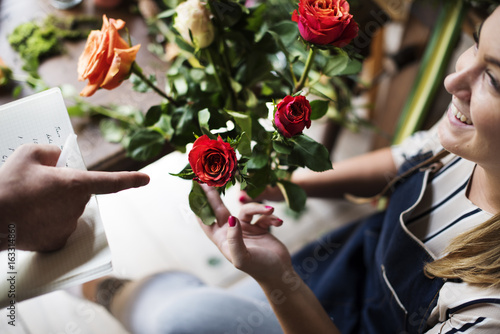 Flowerist working in the flower shop vintage style photo