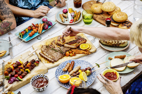 Closeup of homemade grilled food on wooden table summer party