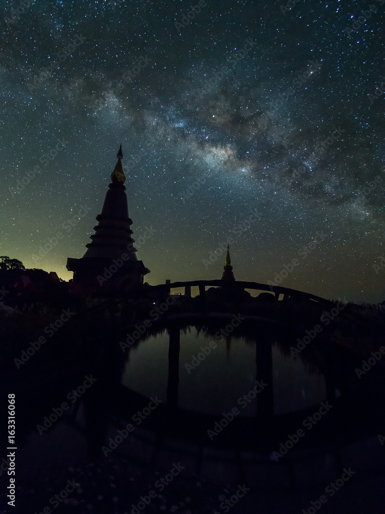 Silhouette pagoda with milky way in dark night at Doi Inthanon, Chiangmai, Thailand