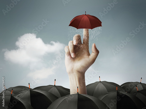 Men's hand came out of the umbrella, the concept of human victory.