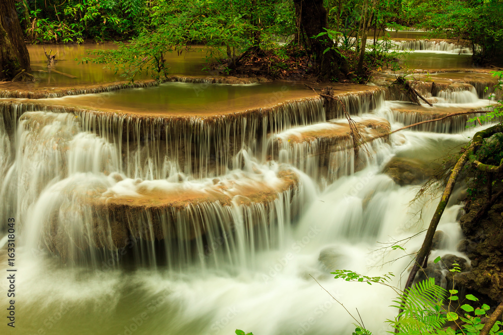 Deep forest waterfall at Huay Mae Kamin waterfall National Park Kanjanaburi Thailand Deep forest waterfall at Huay Mae Kamin waterfall National Park Kanjanaburi Thailand