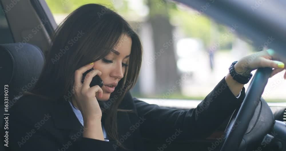Closeup of businesswoman girl lawyer doctor top manager using smart watch on her hands while driving a car, vintage tone, urban background, technology innovation 4k Closeup of businesswoman girl lawyer doctor top manager using smart watch on her hands while driving a car, vintage tone, urban background, technology innovation 4k