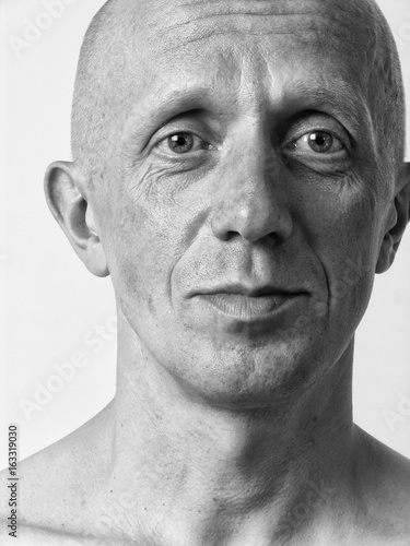Black and white portrait of a bald man