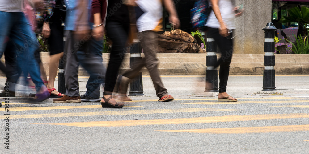 Motion Blur - People crossing the road. Blurry effect to illustrate movement Motion Blur - People crossing the road. Blurry effect to illustrate movement