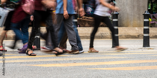 Motion Blur - People crossing the road. Blurry effect to illustrate movement © hafizismail
