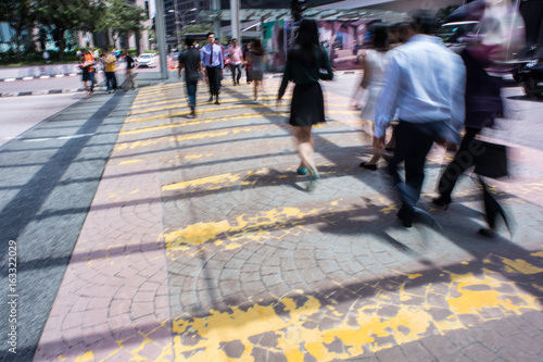 Motion Blur - People crossing the road. Blurry effect to illustrate movement © hafizismail