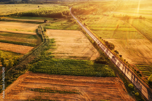 Beautiful aerial view of countryside and fields in sunset photo