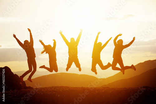 Photography Happy friends jumping sunset mountains