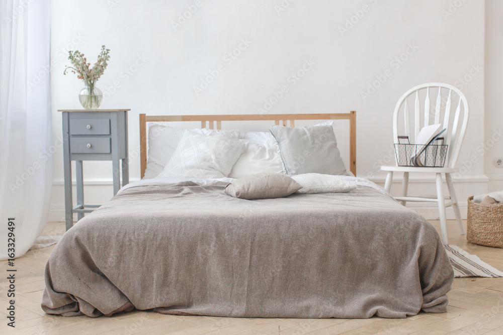 Fototapeta premium Interior of white and gray cozy bedroom