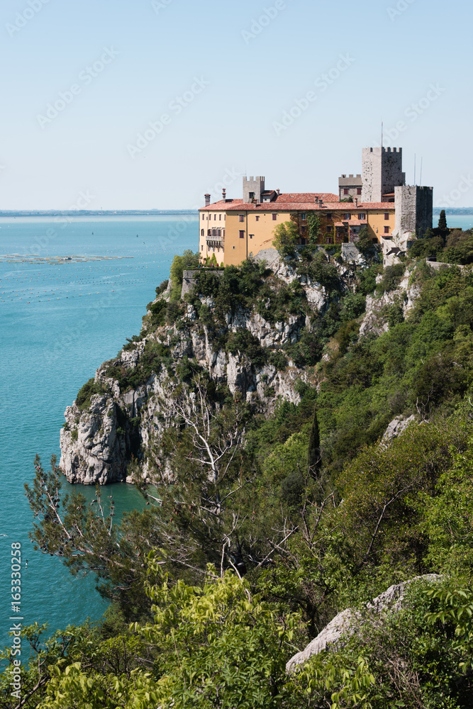 The castle of Duino and the beauty of the cliffs on the rocky coast