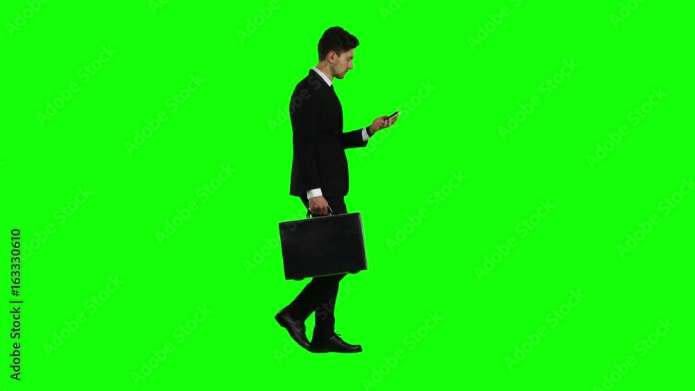 Businessman is a diplomat, a telephone rings to him and he talks. Green screen Businessman is a diplomat, a telephone rings to him and he talks. Green screen