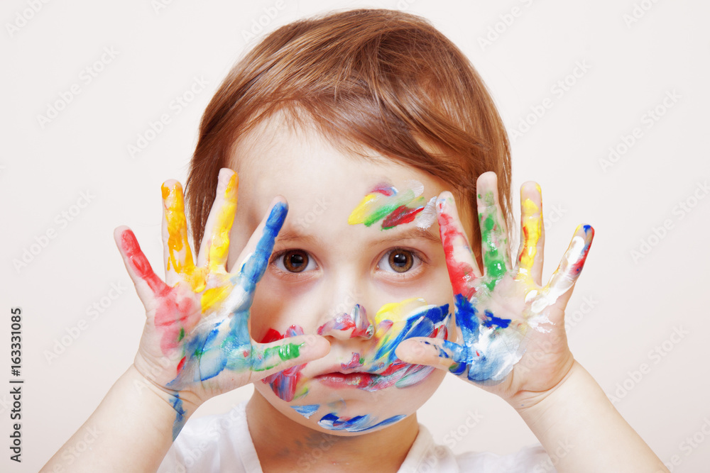 Colorful painted hands in a beautiful young girl (art, childhood, color) Colorful painted hands in a beautiful young girl (art, childhood, color)