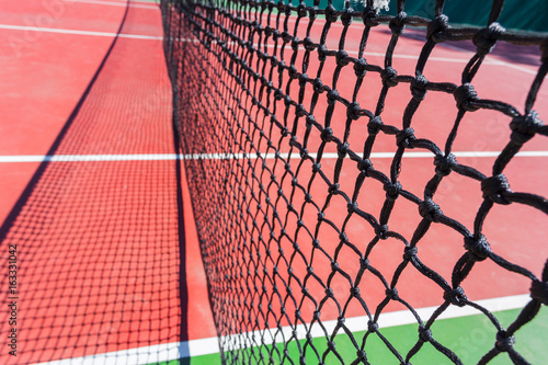 Tennis net on a tennis court background © fotofabrika