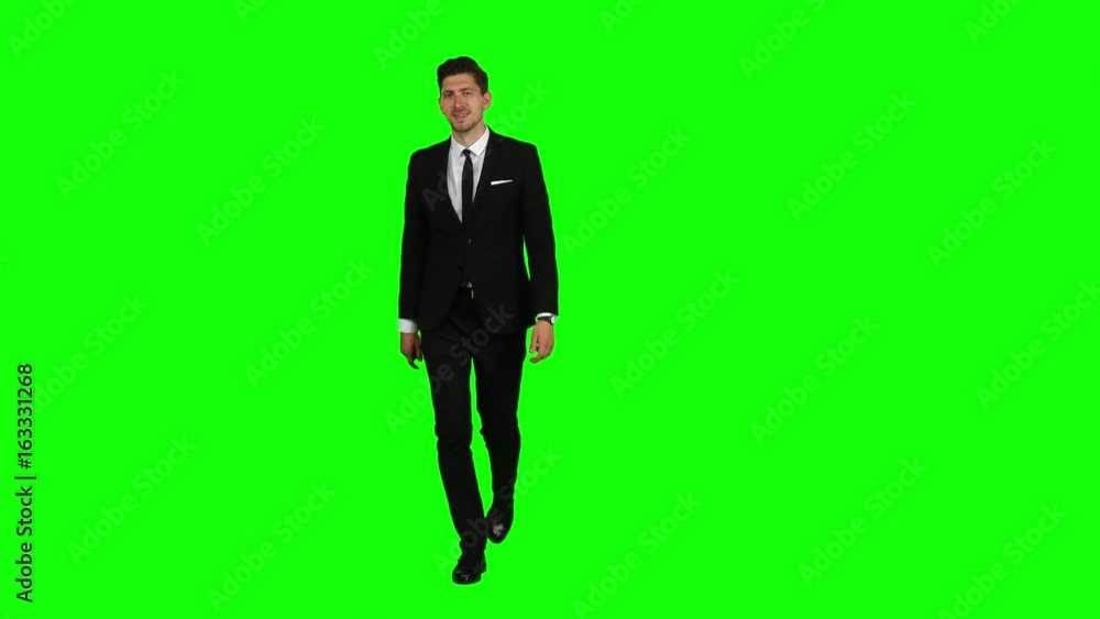 Man is going to a business meeting and waving greetings. Green screen Man is going to a business meeting and waving greetings. Green screen