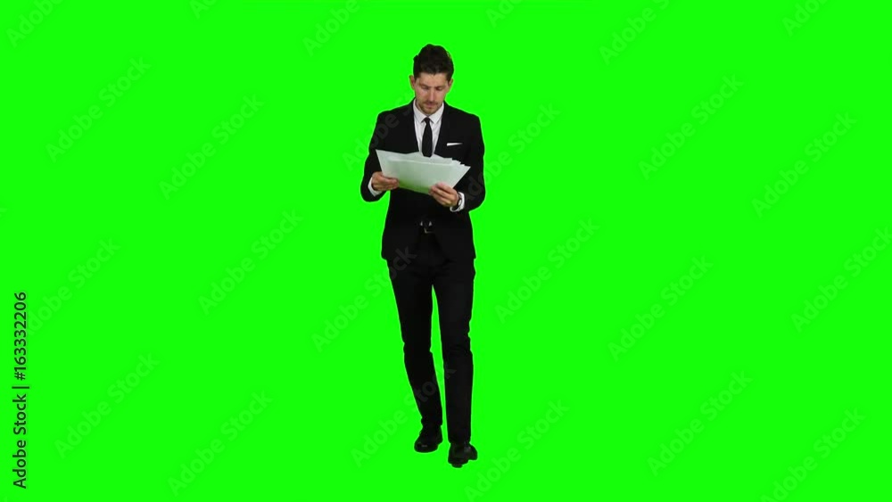 Businessman holds the documents in his hands and throws it away. Green screen Businessman holds the documents in his hands and throws it away. Green screen