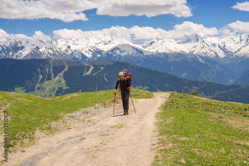 Traveler with big backpack in the mountains © sanechka