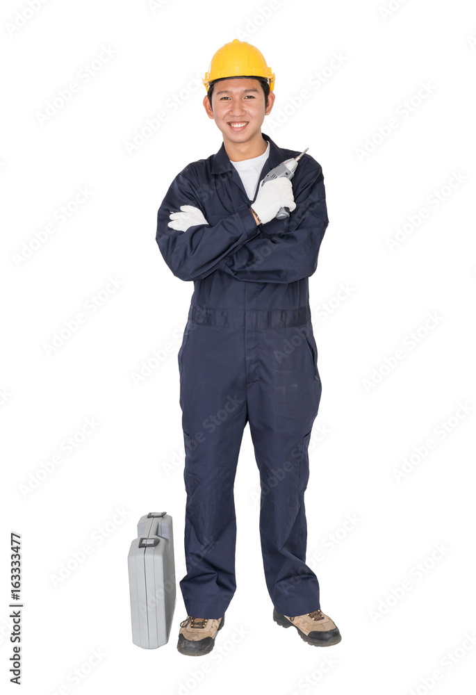 Young handyman standing with his tool box Young handyman standing with his tool box