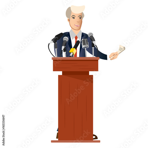 Public speaker with tv microphones.