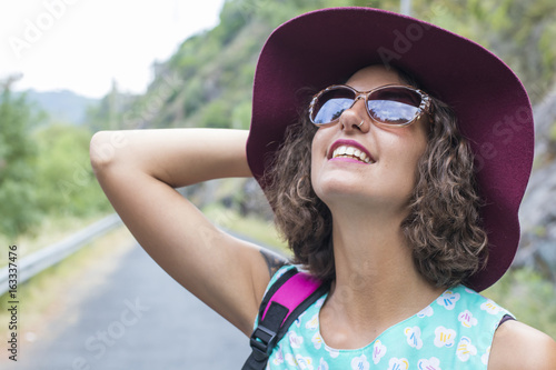 portrait of girl with sunglasses and hat in shorts © carballo