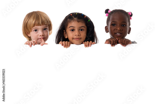 Photography Group of multiracial kids portrait with white board.Isolated