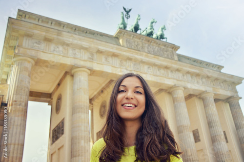 Photography Happy smiling girl in front of Brandenburg Gate, Berlin, Germany